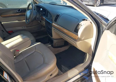 2002 Lincoln Continental z USA, uszkodzony, nr VIN 1LNHM97V12Y614570